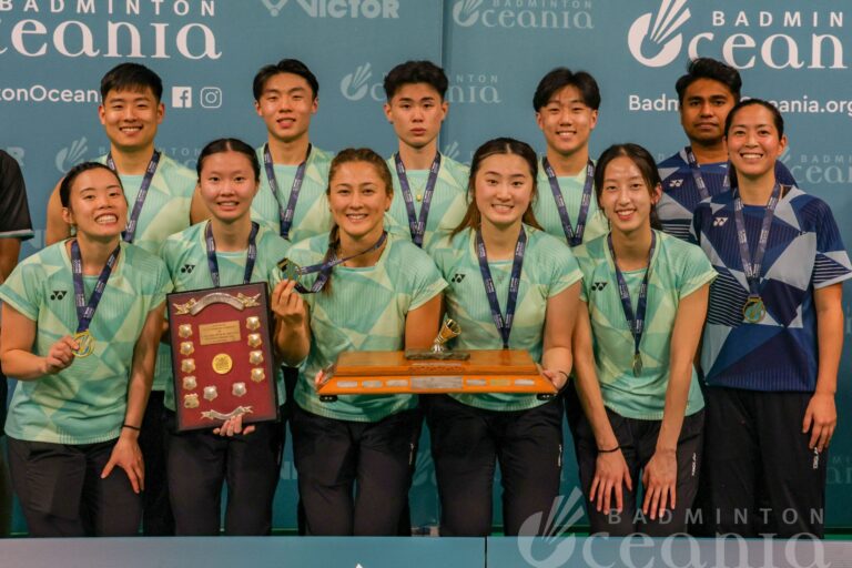 Winners of the VICTOR Oceania Mixed Team Badminton title holding trophy.