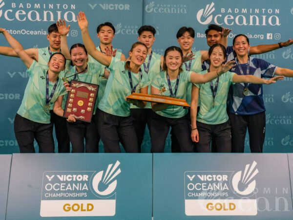 Australia holds the VICTOR Oceania Mixed Team trophy at prizegiving