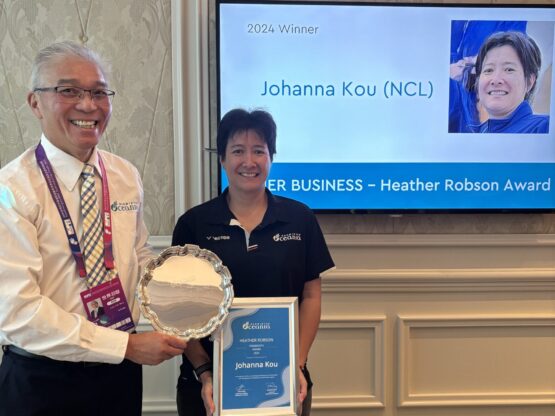 20250424_024350087_iOS Johanna Kou and BPC President pose with award