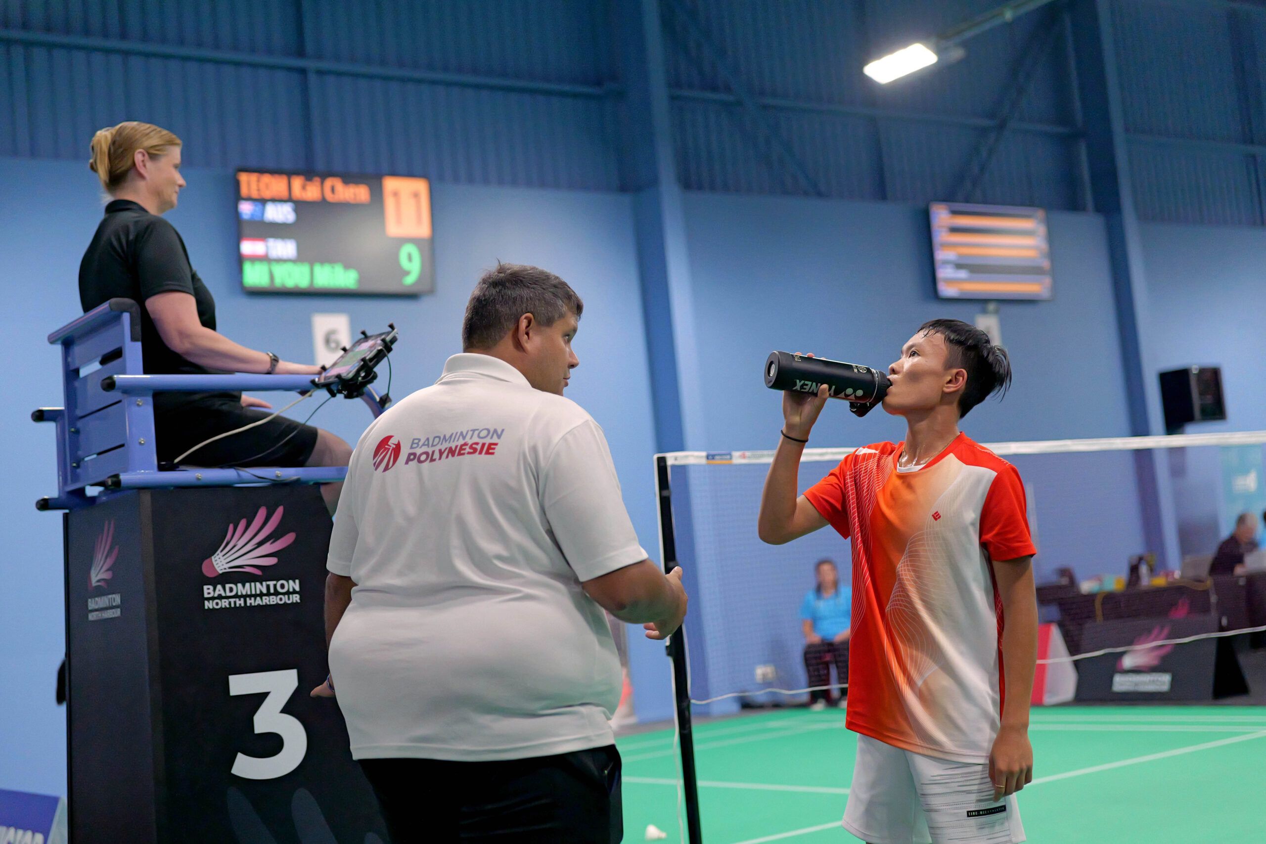 Mike takes a sip from his water bottle during a match break