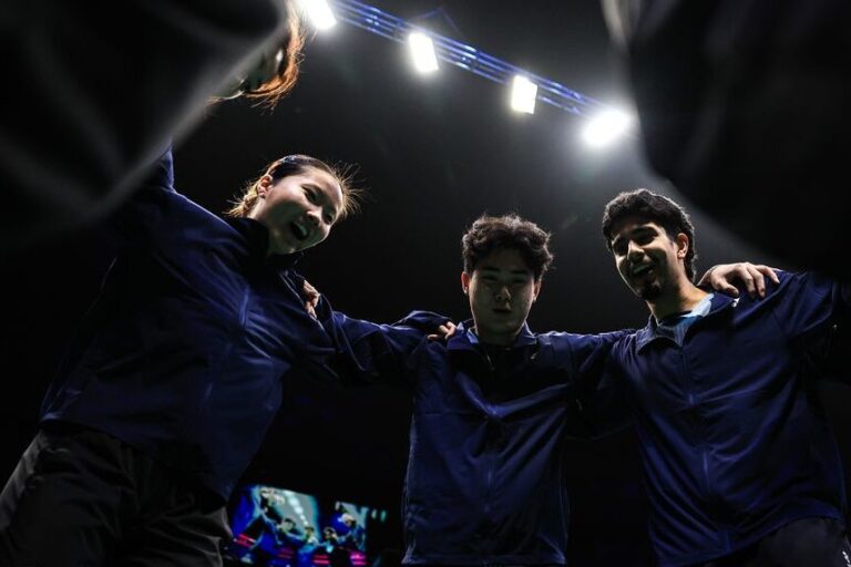 Team huddles before tie starts