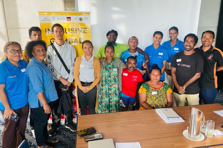 workshop attendees smile for photo