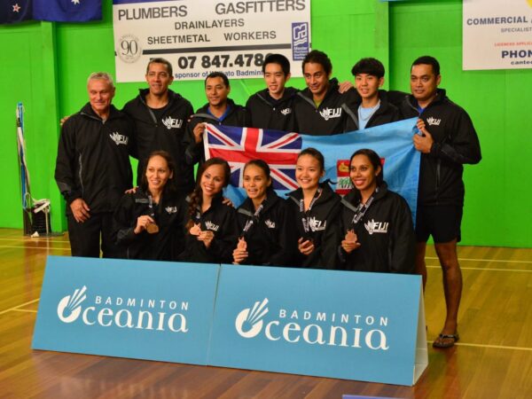 Fiji mixed badminton team poses with medals