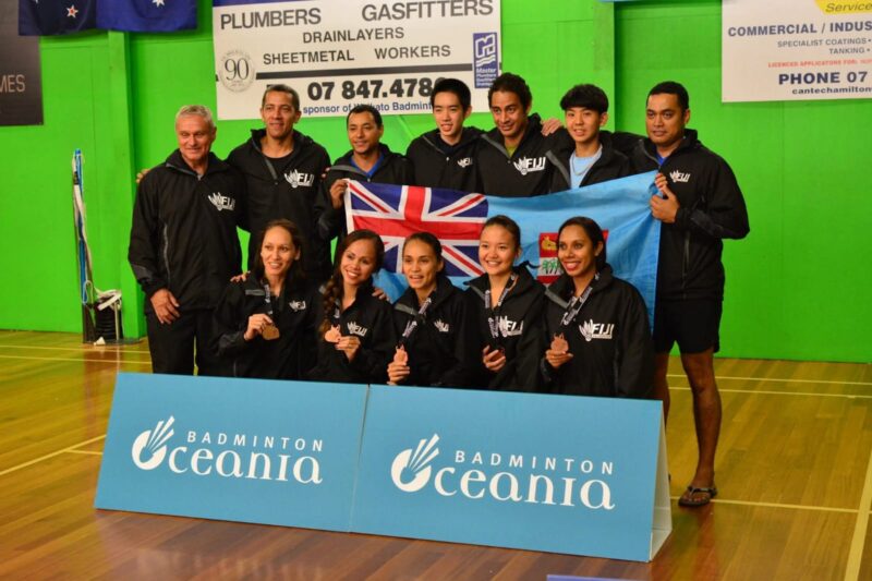 Fiji mixed badminton team poses with medals